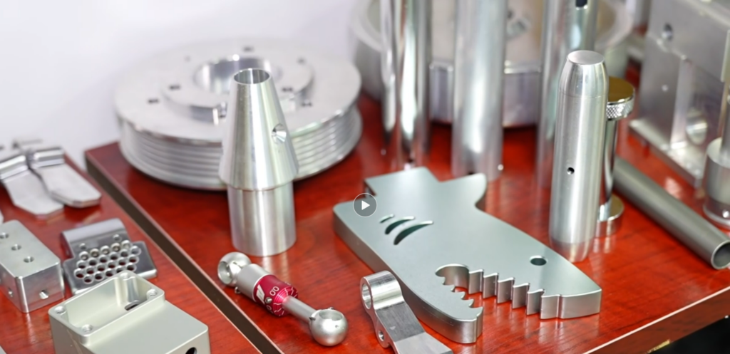 Image with many sample products including a wheel hub, a shark hood ornament (with teeth), a metal filter, and different kinds of pipes and structural components
